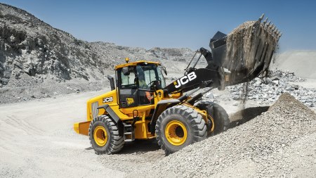 JCB wheel loader moving material